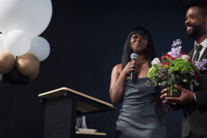 Robin Boylorn receives flowers at the Holle Center opening