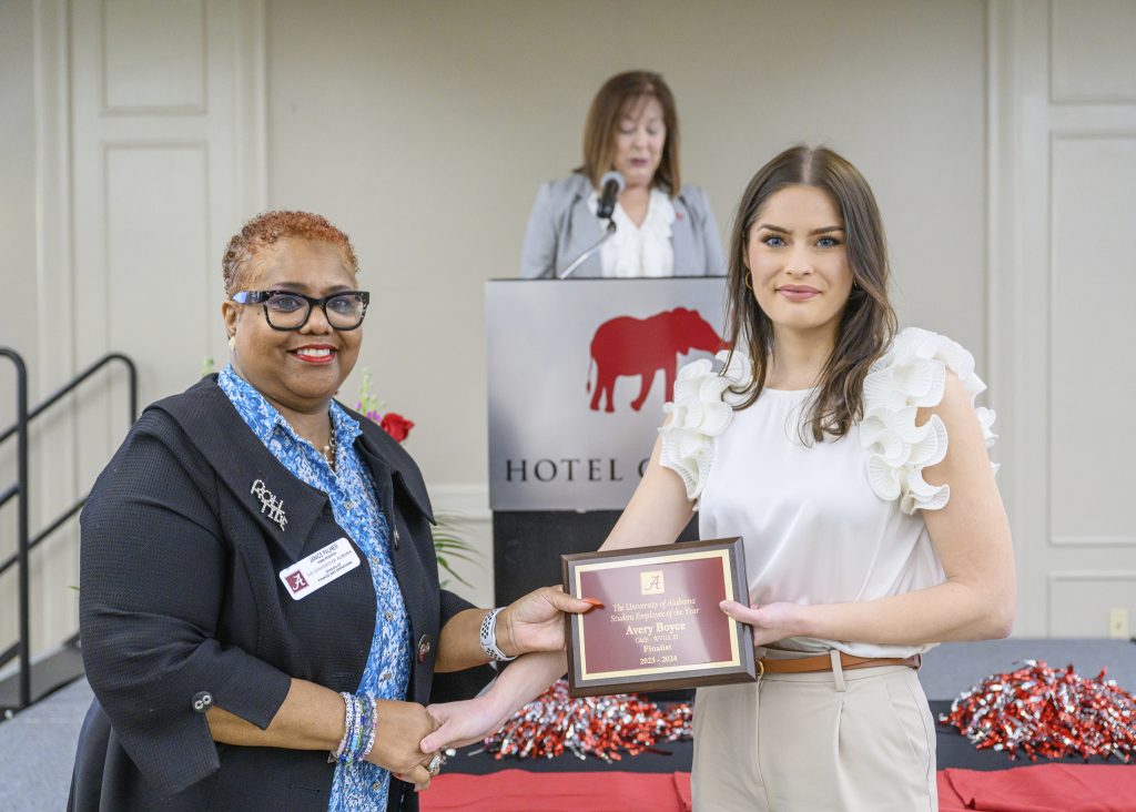 Avery Boyce accepts award