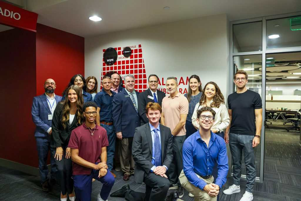 Members of the State Department post for a photograph in the DMC